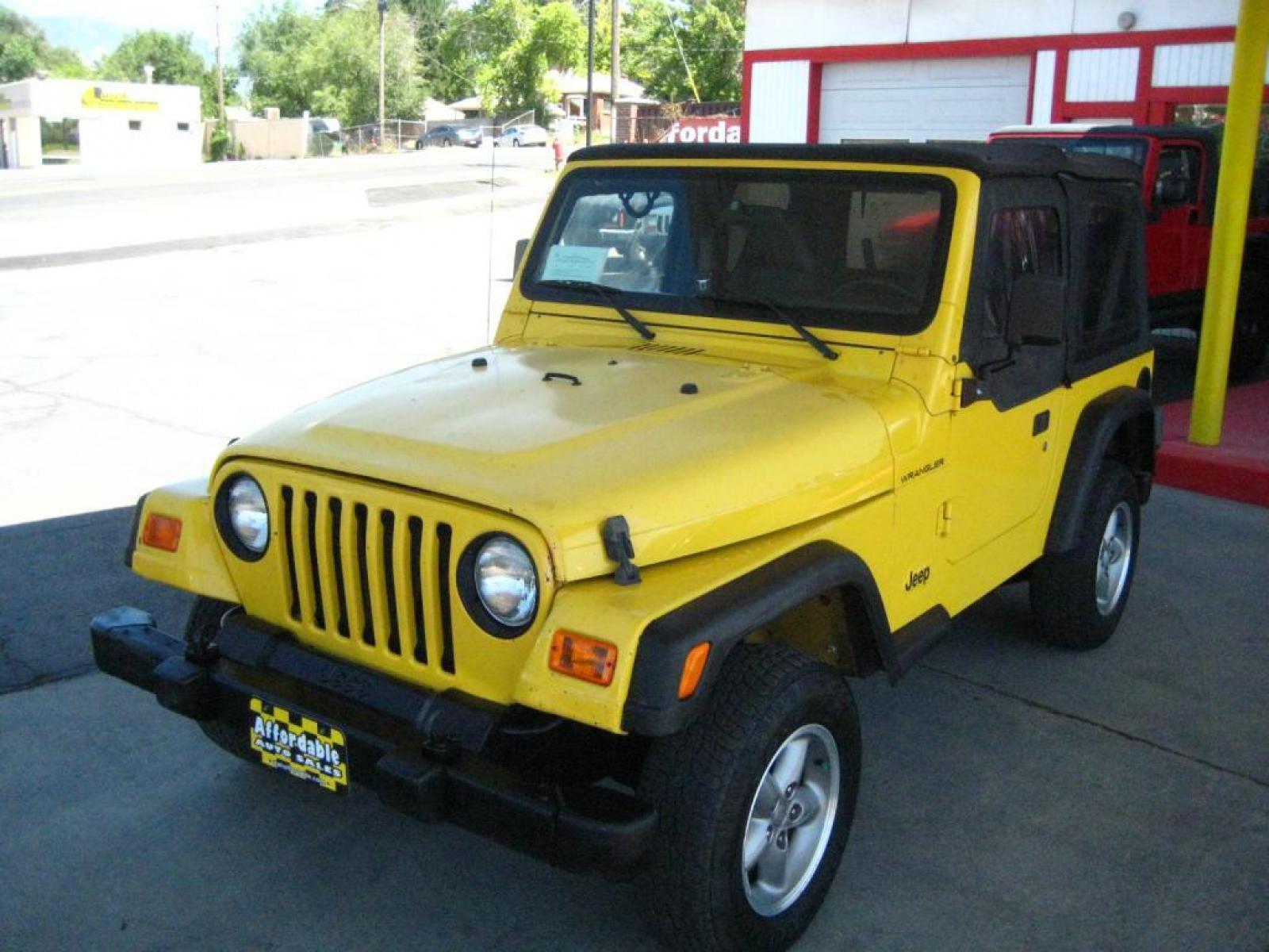 2001 Yellow /Black Jeep Wrangler SE (1J4FA29P41P) with an 2.5L L4 OHV 8V engine, automatic transmission, located at 3819 South Hwy 89, Bountiful, UT, 84010, (801) 298-3777, 40.876678, -111.870071 - SOLD To check out similar vehicles and our entire inventory go to www.utahaffordable.com. - Photo #0