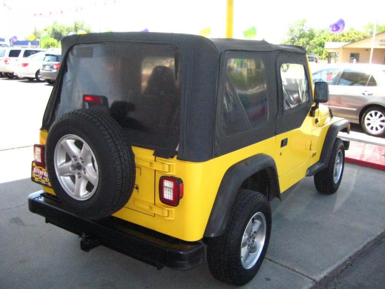2001 Yellow /Black Jeep Wrangler SE (1J4FA29P41P) with an 2.5L L4 OHV 8V engine, automatic transmission, located at 3819 South Hwy 89, Bountiful, UT, 84010, (801) 298-3777, 40.876678, -111.870071 - SOLD To check out similar vehicles and our entire inventory go to www.utahaffordable.com. - Photo #2