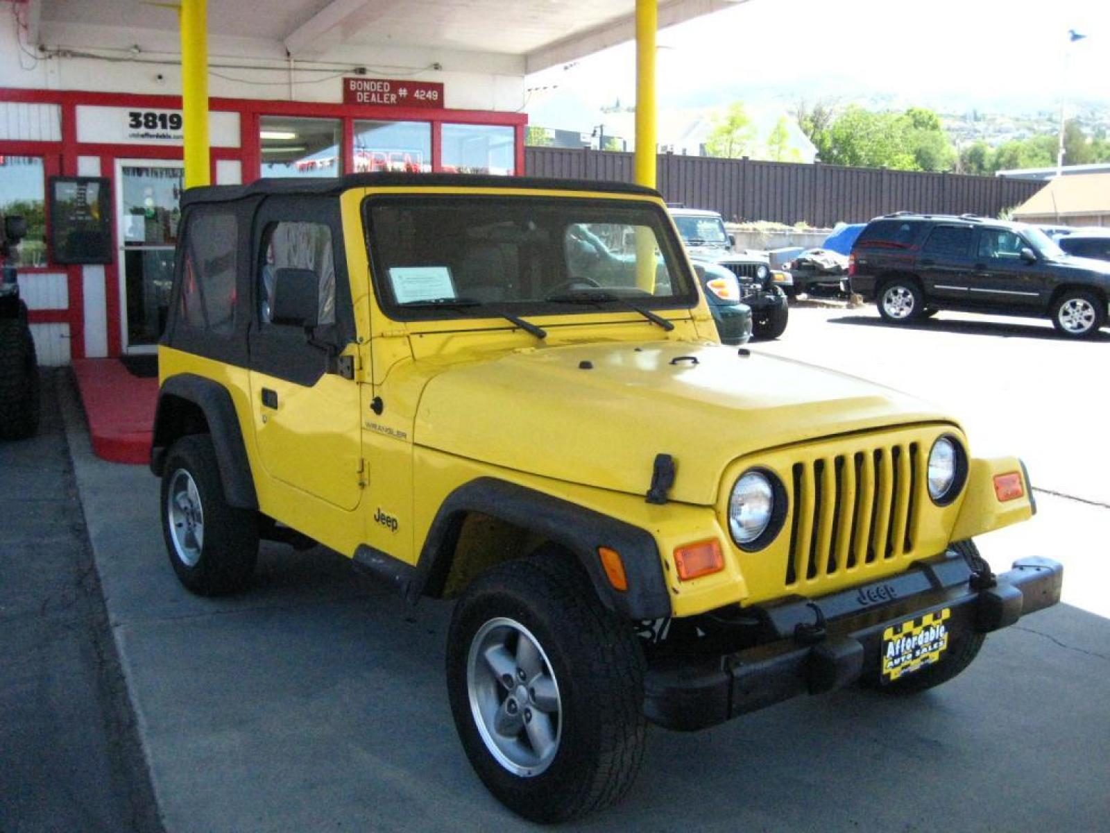 2001 Yellow /Black Jeep Wrangler SE (1J4FA29P41P) with an 2.5L L4 OHV 8V engine, automatic transmission, located at 3819 South Hwy 89, Bountiful, UT, 84010, (801) 298-3777, 40.876678, -111.870071 - SOLD To check out similar vehicles and our entire inventory go to www.utahaffordable.com. - Photo #3